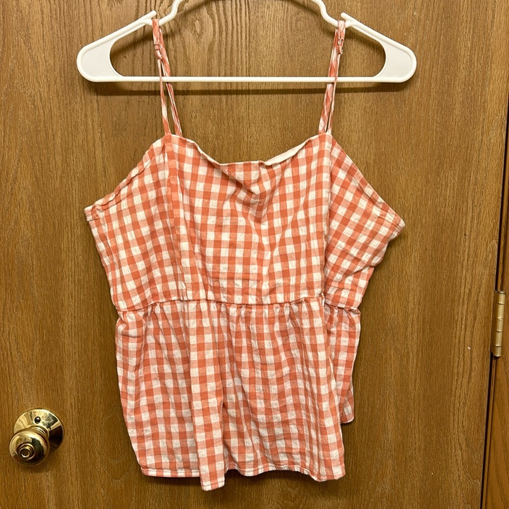 Spaghetti strap tank top, size XXL but fits more like a L or XL.